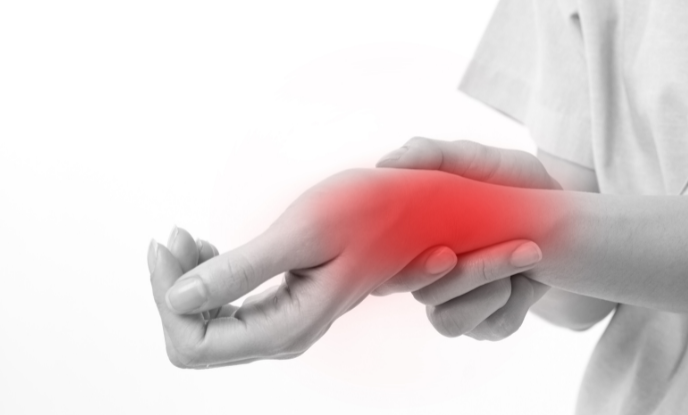Woman holding wrist suffering joint pain.