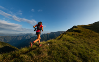 Woman running up mountain